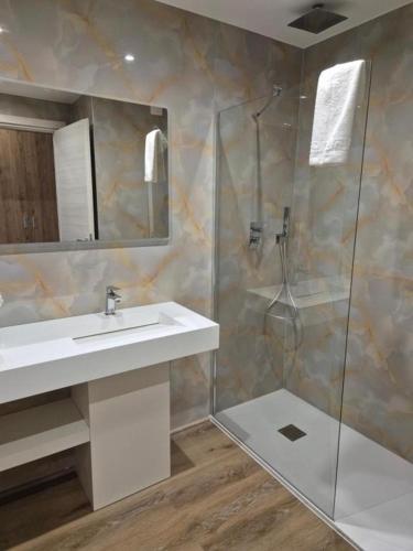 a bathroom with a sink and a shower at Hsdominicus in Cirella