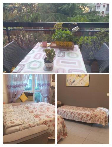 a table with a couch and a table with plants at Focolare domestico in Milan