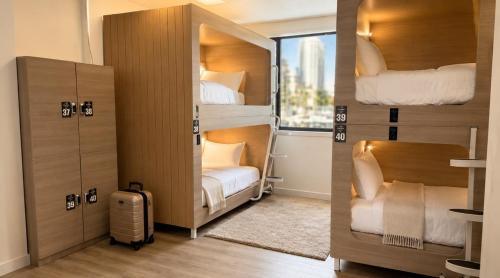 a couple of bunk beds in a room at Paradise Pods in Gold Coast