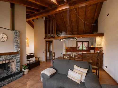 a living room with a couch and a fireplace at Casa Jonico in Montardit
