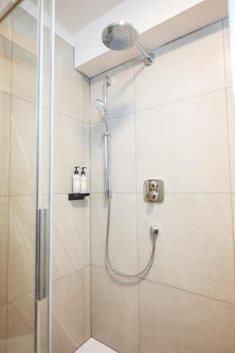 a shower with a shower head in a bathroom at Lasa Pur Dir in Piran