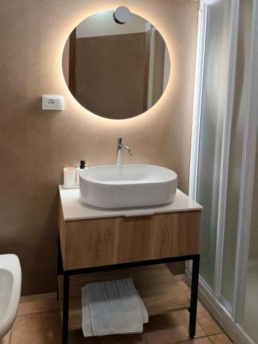 a bathroom with a sink and a mirror at Agriturismo La Rasdora in Porto Mantovano