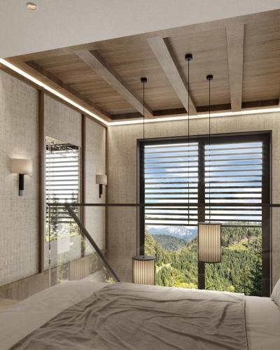 a bedroom with a large bed and a large window at West Hill Apart Hotel in Kopaonik