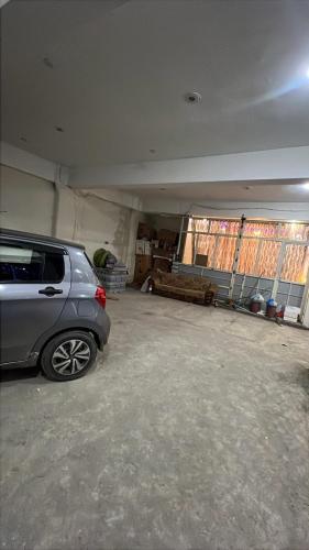 a garage with a car parked in it at Moon Palace by MZ Hotels Pakistan KPK in Mingāora