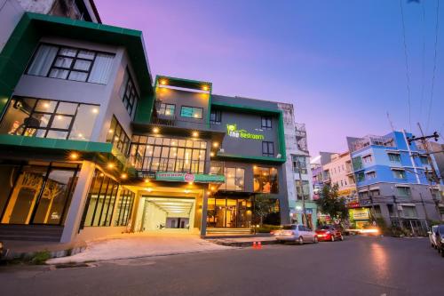 a building on the side of a city street at The Bedroom in Hat Yai