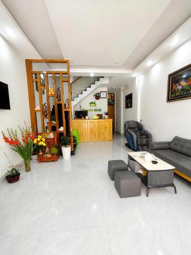 a living room with a couch and a table at Thanh Nhã House in Da Lat