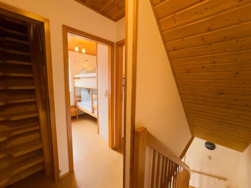 a hallway with a staircase leading to a bedroom at Tegeler Plate 26 in Wangerland