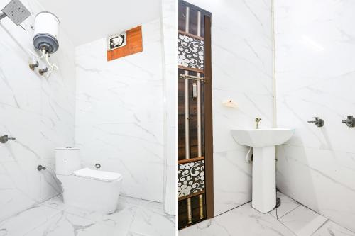 a bathroom with a toilet and a sink at FabHotel Mohini Palace in Vrindāvan