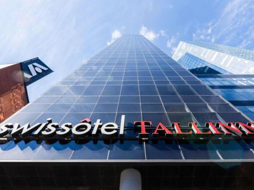 a view of theissotel hall building with a sign at Swissotel Tallinn in Tallinn