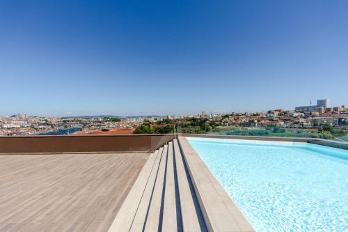 Premium Living with Pool, Balcony, Gym & Garage by HostWise