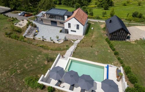 an aerial view of a house with a swimming pool at Beautiful Home In Banfi in Štrigova