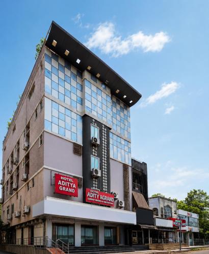 a building with a sign on the side of it at Hotel Aditya Grand in Guntūr