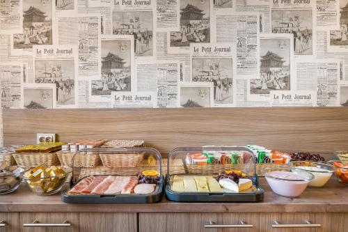 two trays of food on top of a counter at Signature Hotel Astoria in Hamburg