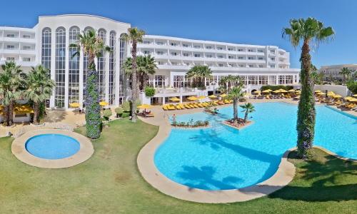 an aerial view of a hotel with a large swimming pool at LAICO Hammamet hotel in Hammamet