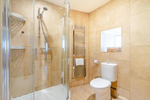 a bathroom with a toilet and a shower at 3 Bed in Askrigg oc-ds779 in Askrigg