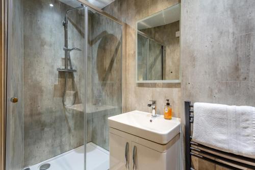 a bathroom with a shower and a sink at 1 Bed in Callander oc-pe173 in Strathyre