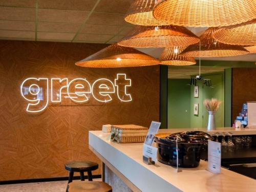 a store with a sign that reads greevelt at Greet Hotel Colmar in Colmar