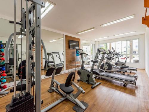 a gym with treadmills and elliptical machines at Ibis Styles Campinas Alphaville in Campinas