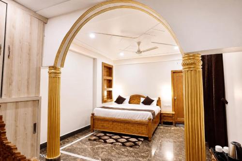 an archway in a bedroom with a bed in it at The Palace by Boho Travelista in Bhīm Tāl