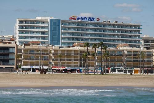 a hotel on the beach next to the beach at Hotel Natura Park in Comarruga
