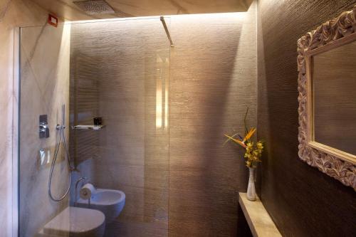 a bathroom with a shower with a toilet and a sink at B&B Il Parco in Monterosso al Mare