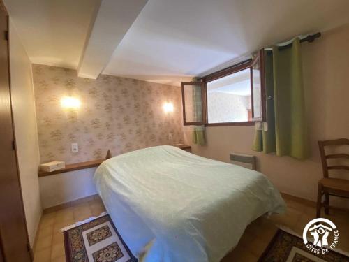 a small bedroom with a bed and a window at Ribelles in Eus