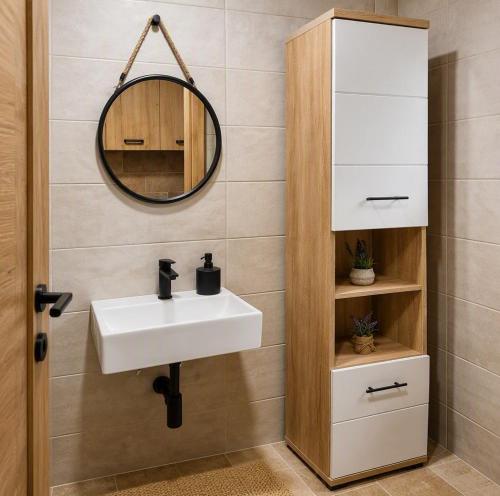a bathroom with a sink and a mirror at Casa Ondina - Private House with Jacuzzi & Big Garden in Central Istria in Šumber
