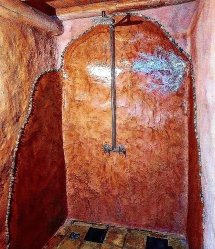 a painting of a door in a room at Kamiare in San Esteban
