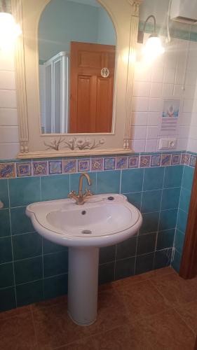 a bathroom with a sink and a mirror at Casa Las Maletas in Morote