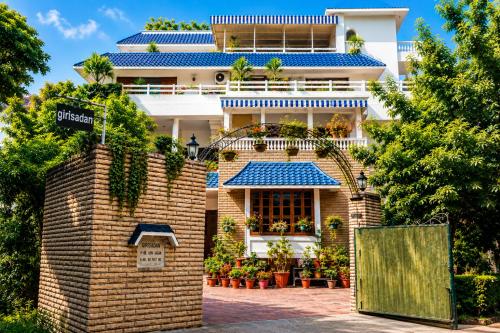 a building with plants on the front of it at Girisadan - A City Centre Boutique Hotel in Jaipur