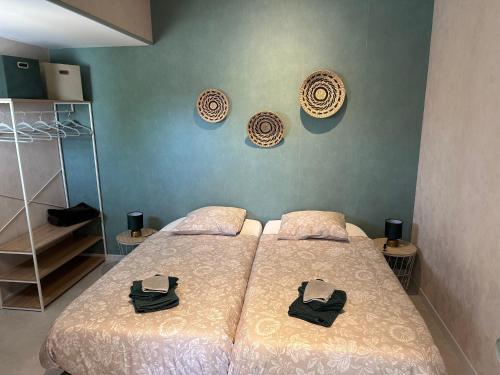 a bedroom with a bed with two pillows on it at CozyCocoon Appartement in Parcey
