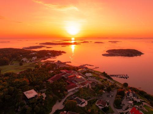 an aerial view of a island in the water at sunset at Säröhus Hotel, Conference & Spa in Särö