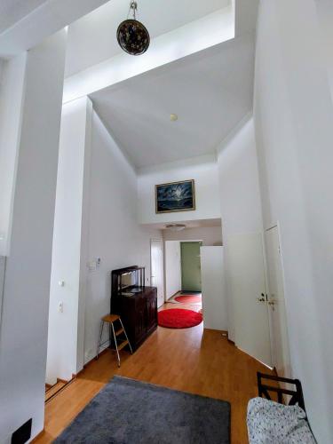 a room with white walls and a ceiling at Semi-detached house with sauna & yard near city center in Hyvinkää