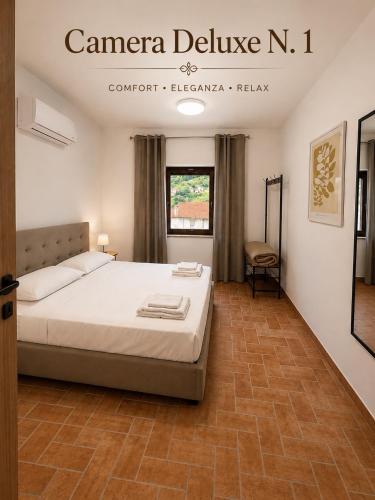 a bedroom with a bed and a sign that reads camera deliver at B&B Colle Alto in Carovilli