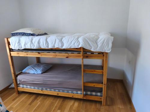 a couple of bunk beds in a room at Maison Relax in Flers