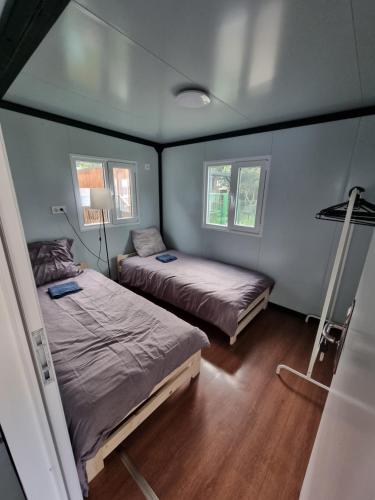 a small room with two beds in a house at MAZI HOUSE Jastarnia in Jastarnia