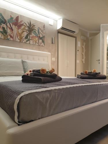a bedroom with two beds with teddy bears on them at Dimore Angye in Termoli