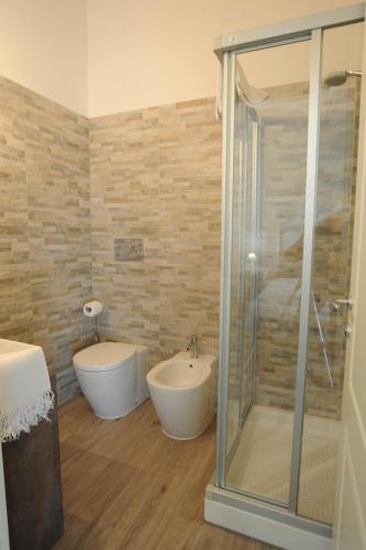 a bathroom with a shower and a tub and a sink at Agriturismo Tenuta Polledro in Asti