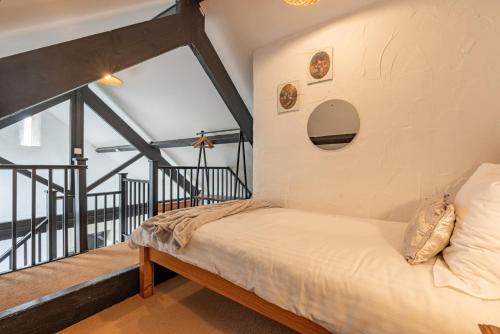 a bedroom with a bed and a large window at Trespaddick, coastal views Treworgie Barton in Bude