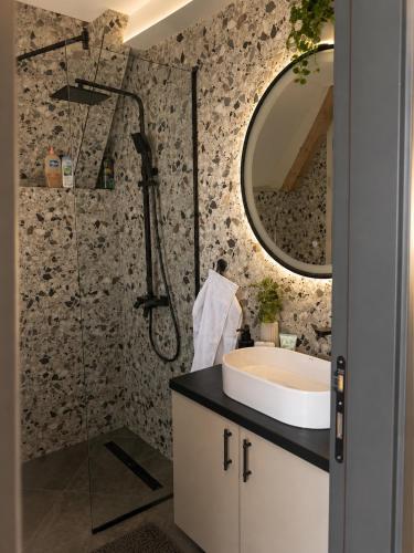 a bathroom with a sink and a mirror at Monte Casa Žabljak in Žabljak
