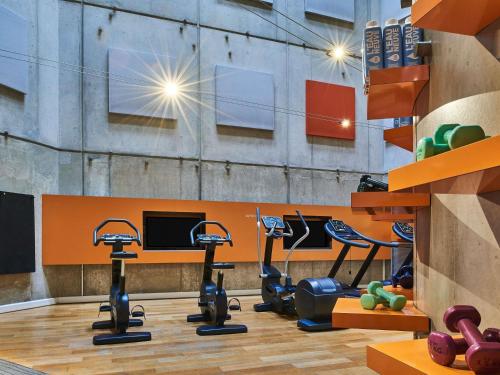 a gym with treadmills and elliptical machines at Novotel Paris Gare De Lyon in Paris
