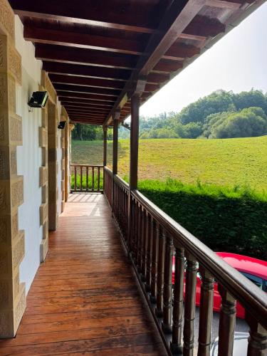 a porch of a house with a view of a field at Finca La Sierra in Abionzo
