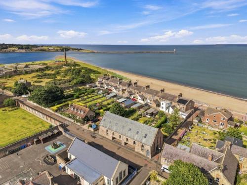 an aerial view of a small town next to a beach at 5 Old Templars - North East Escapes in Spittal