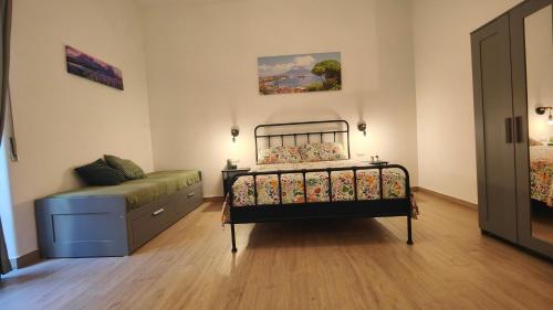 a bedroom with a bed and a dresser at San Gregorio Suite&Rooms in Naples
