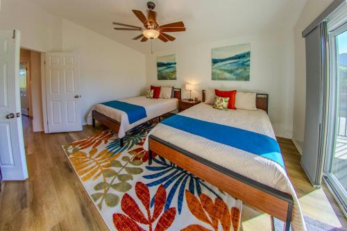 a bedroom with two beds and a ceiling fan at Pool & Yard Games! Group Retreat in La Quinta in La Quinta