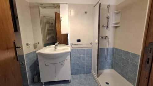 a bathroom with a sink and a toilet and a shower at Casa vacanze Donna Santa in San Marco dʼAlunzio