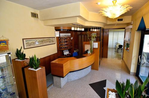 a lobby with a reception desk in a building at Hotel Nuova Mestre in Mestre