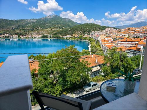 a view of a city and a lake from a balcony at Adriana Luxury Studio in Kastoria