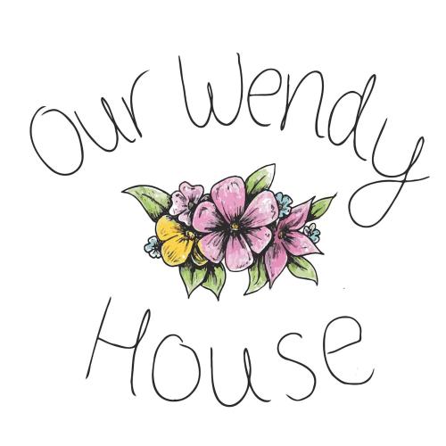 a sketch of a flower with the words our new flower house at Our Wendy House in Holsworthy