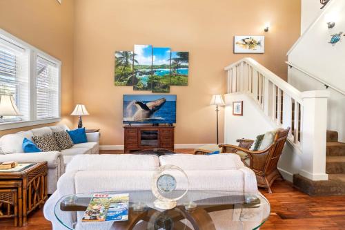 a living room with a couch and a table at Halii Kai 20F in Waikoloa